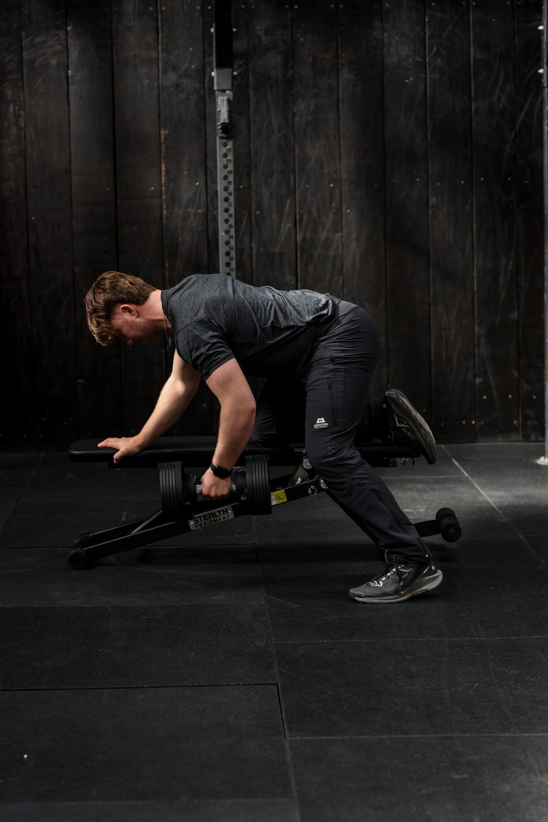 Samuel, the author doing supported rows using Stealth Core Edition adjustable dumbbell