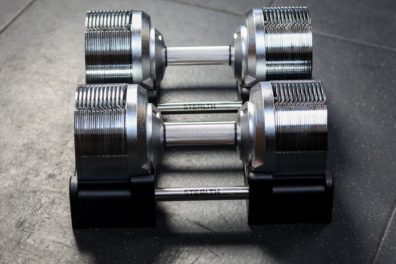 Stealth Chrome Edition adjustable dumbbells in their base