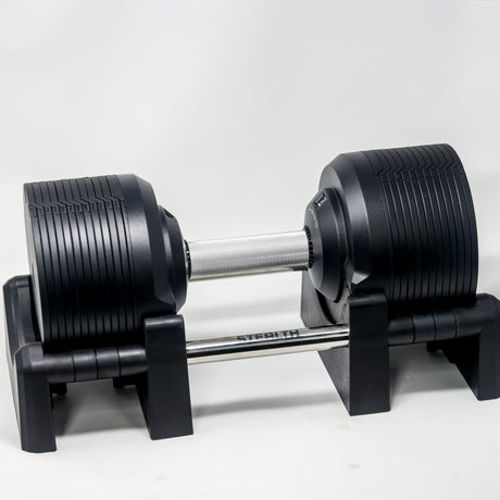 Side view of the Stealth Adjustable Dumbbells Black Edition on its cradle stand - Assassin Goods